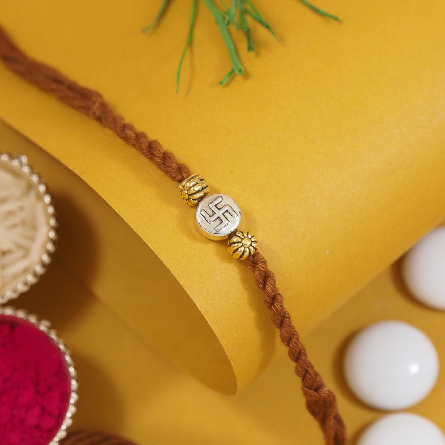Swastik Brown Thread Rakhi with Roli Chawal & Raksha Bandhan Card