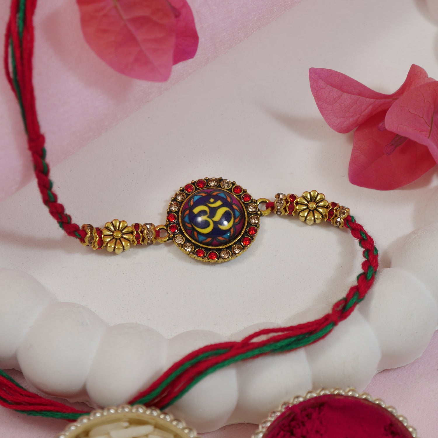 Enamel Om Rakhi for Bhai with red and green thread