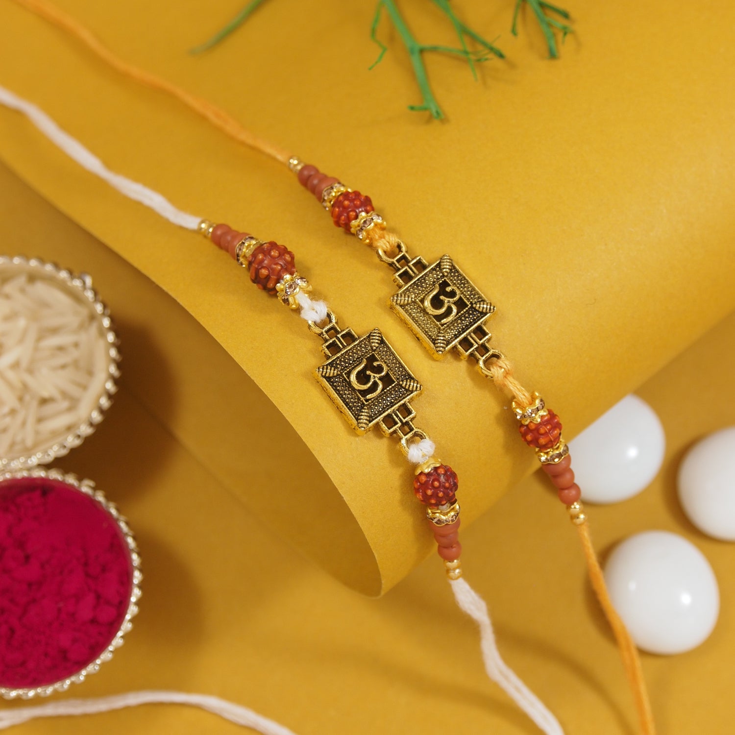 Designer OM Rakhi Set with Roli Chawal & Rakshabandhan Card (Pack of 2)