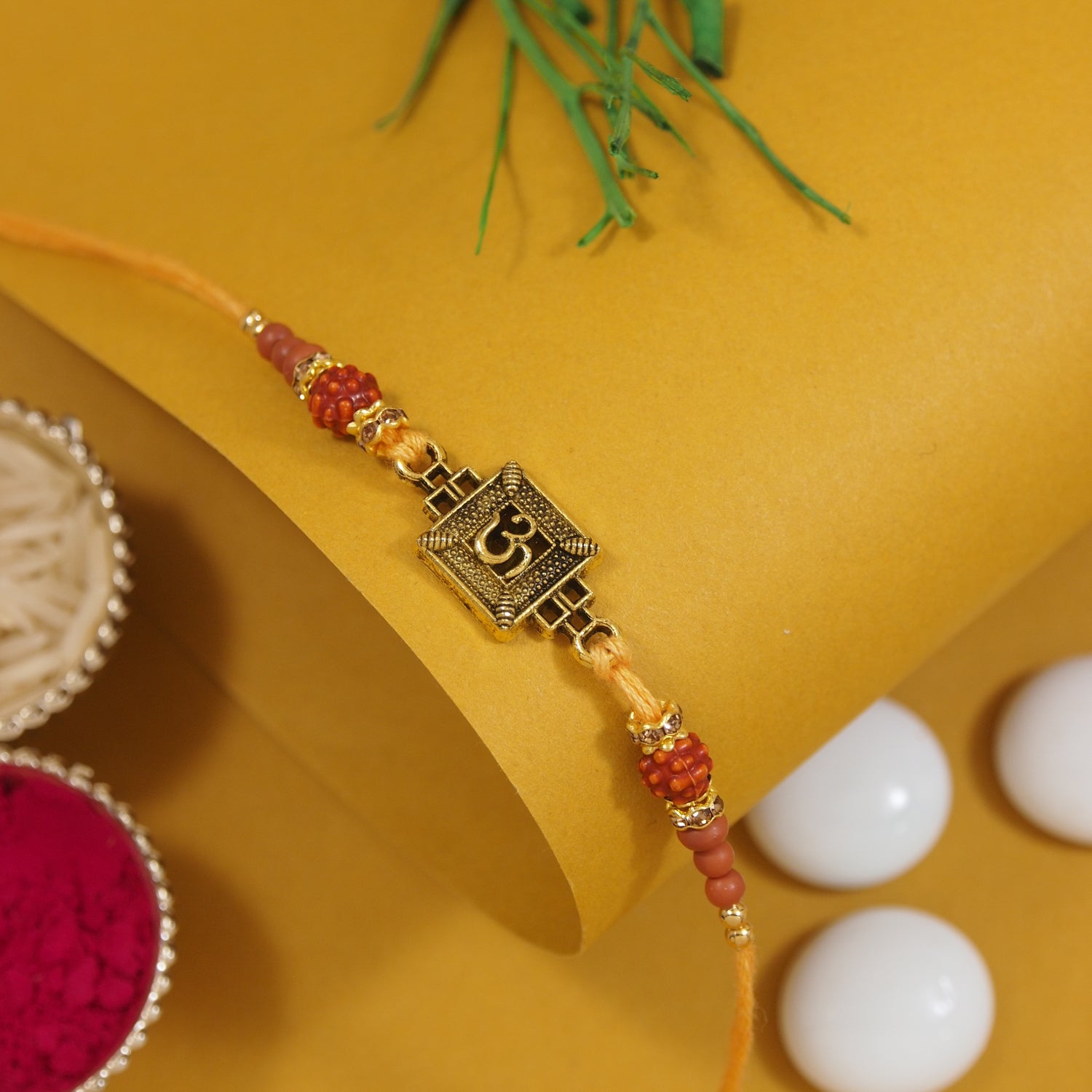 Om Yellow Rakhi with Roli Chawal & Rakshabhandan Card