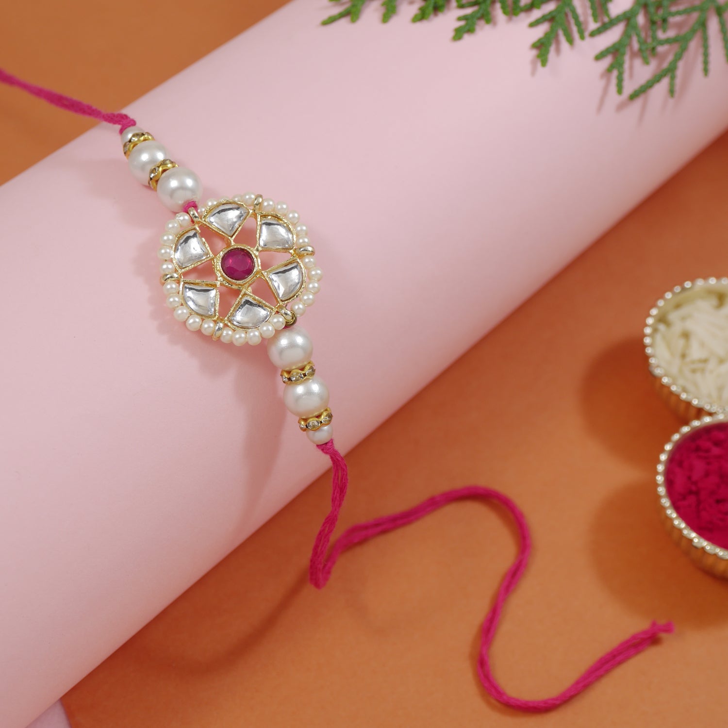 kundan rakhi for bhai with red and white beads
