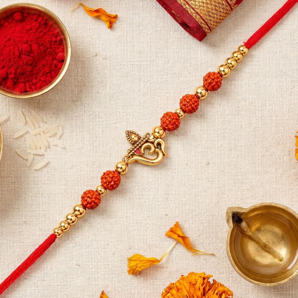 OM Pearl Beaded Rakhi with Roli Chawal & Rakshabandhan Card
