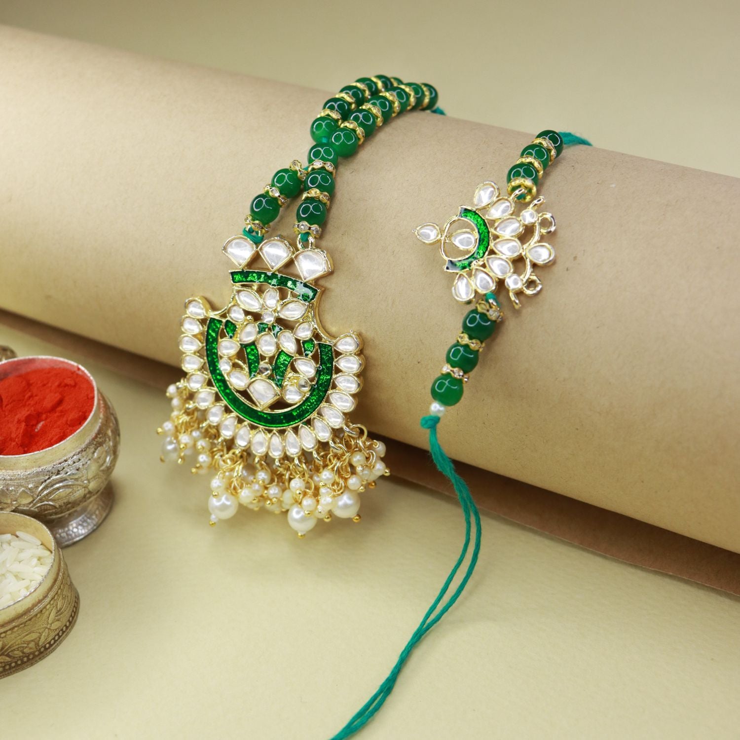 meenakri , kundan , pearls ,stones ,lumba rakhi