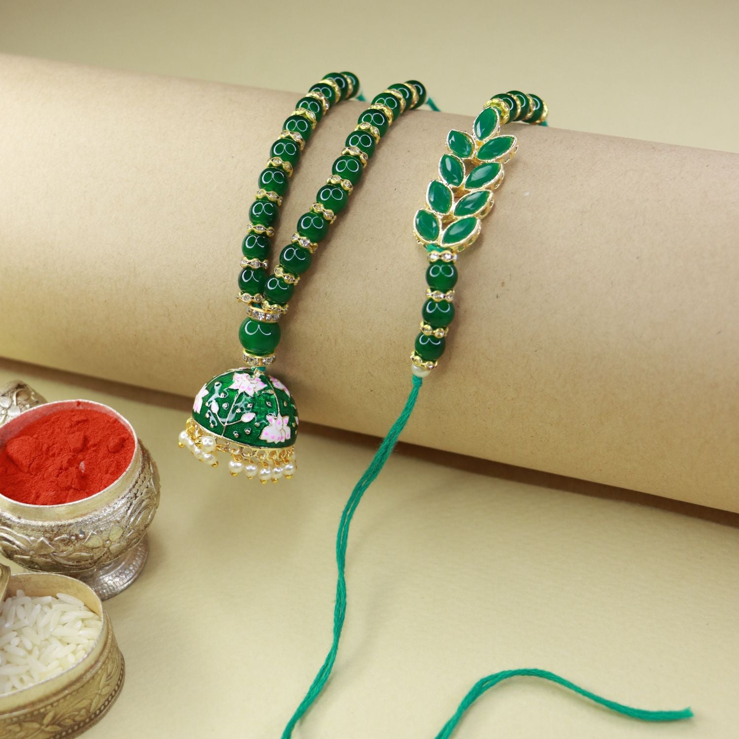meenakri , kundan , pearls ,stones ,lumba rakhi