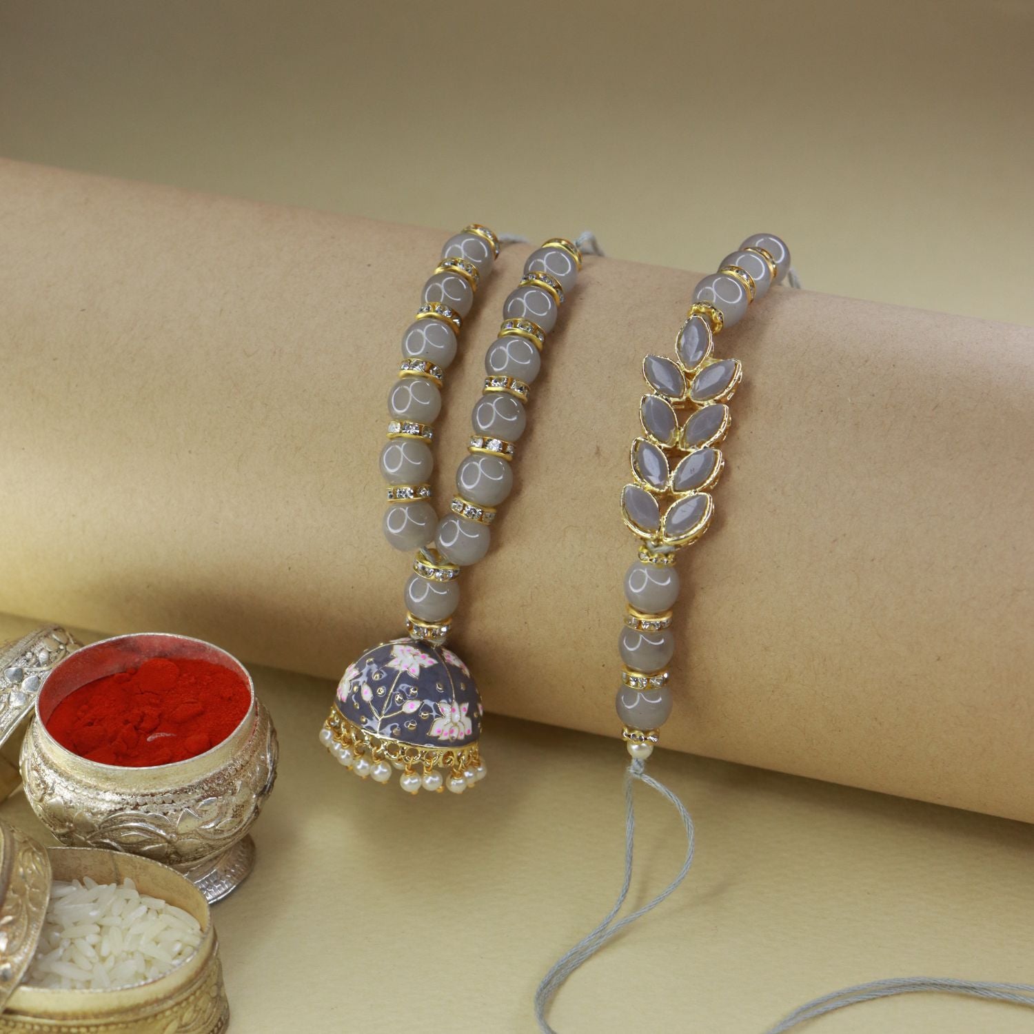 meenakri , kundan , pearls ,stones ,lumba rakhi