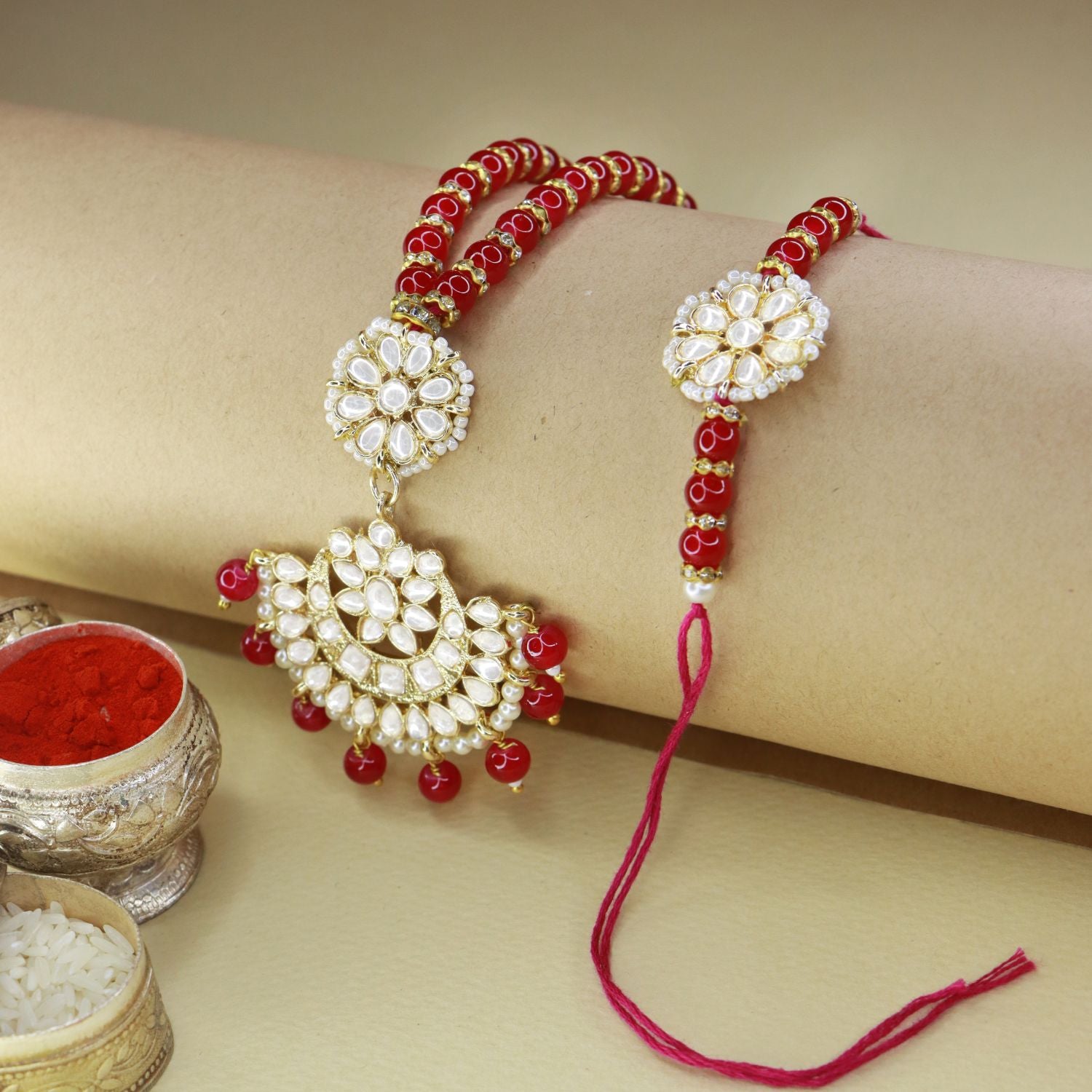 kundan , pearls ,stones ,lumba rakhi