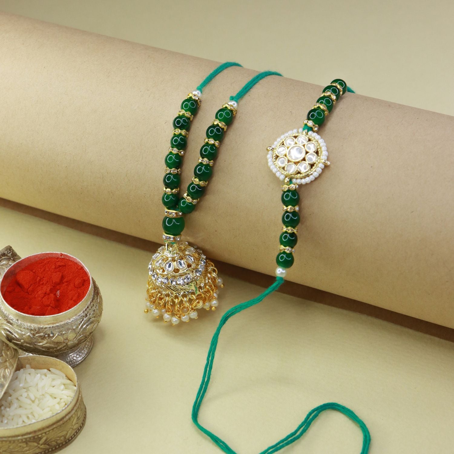  kundan , pearls ,stones ,lumba rakhi