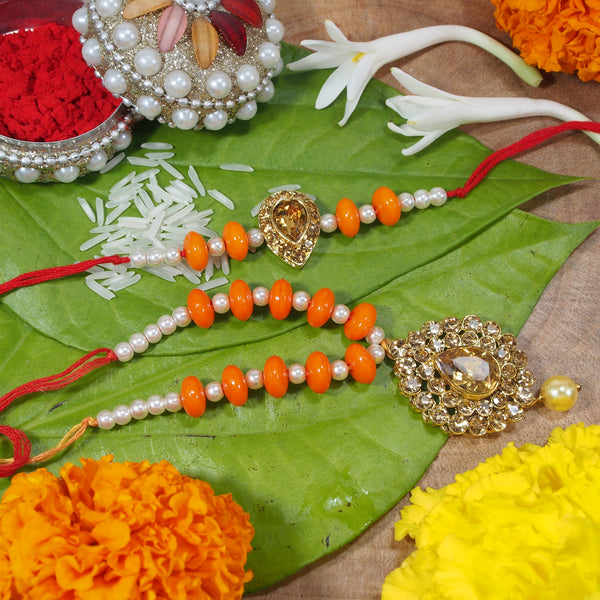 Yellow Gold Plated Pearl and Stone Studded Rakhi for Bhaiya and Bhabhi