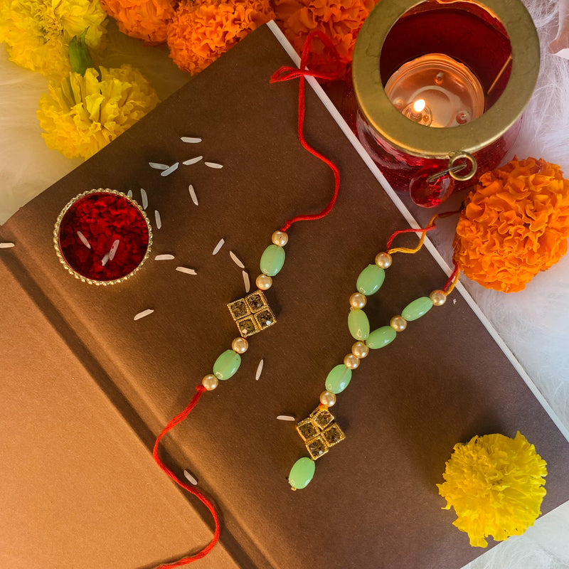 Gold Plated Designer Stone Studded Pearl Mint Rakhi Set for Bhaiya Bhabhi